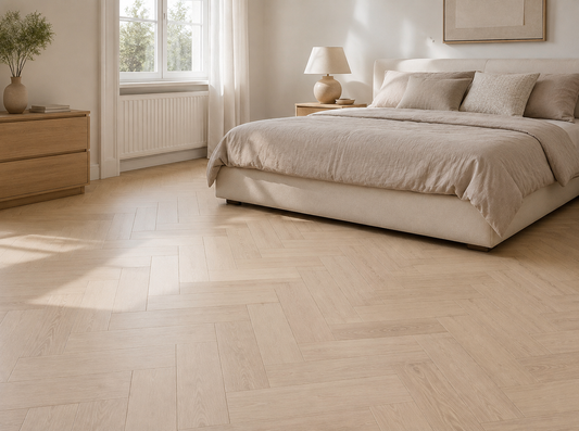 Halmstad pale oak herringbone laminate in a modern bedroom