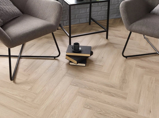 Malmo 12mm Herringbone Laminate in a furnished room
