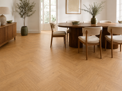 Odense natural oak herringbone laminate in a refined dining room