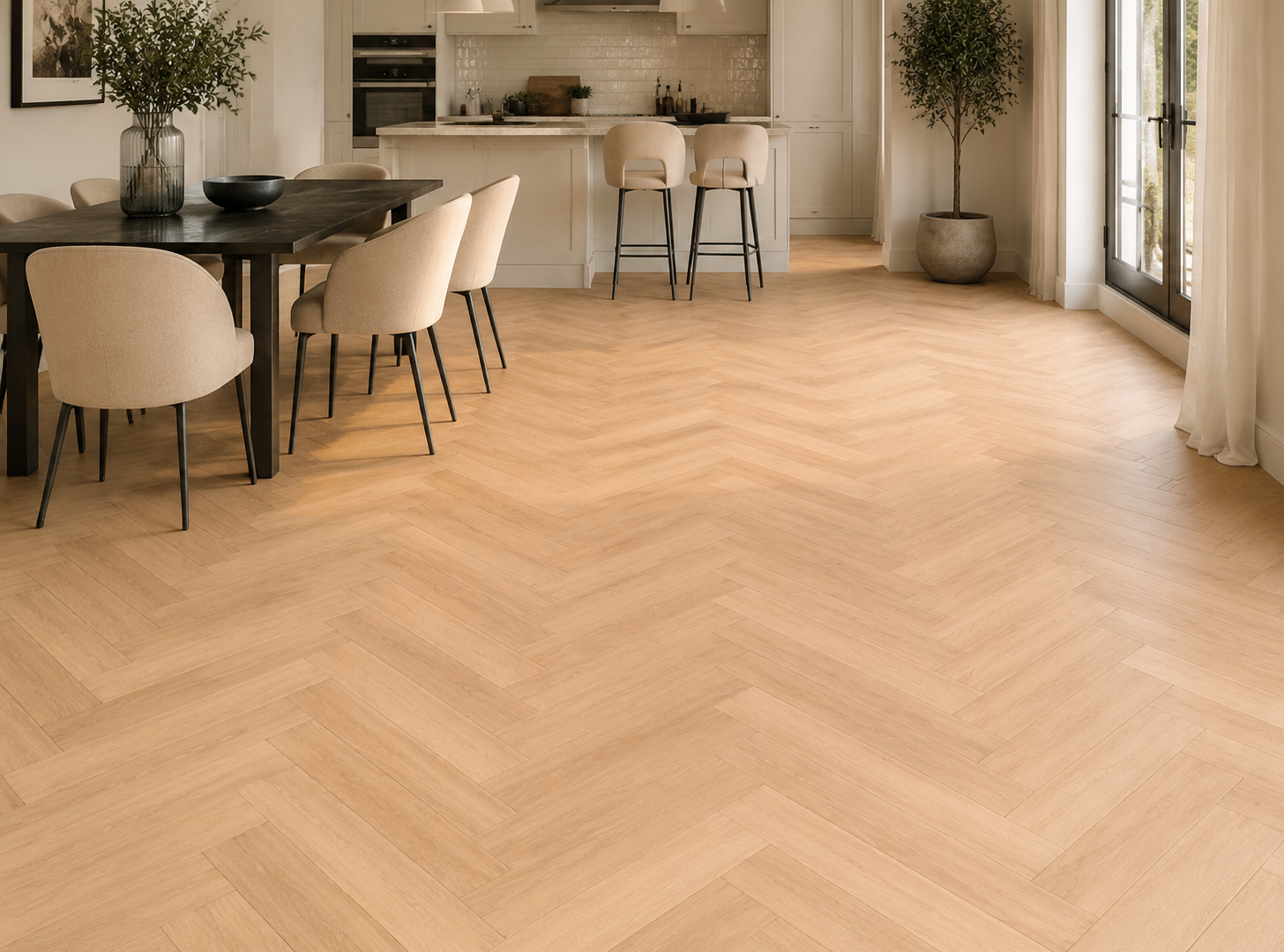 Tromso warm oak herringbone laminate in a bright kitchen diner